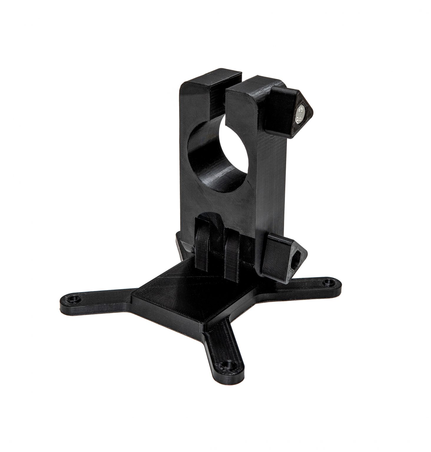 Monitor mount isolate on a white background. Black detail mount printed on a 3D printer.